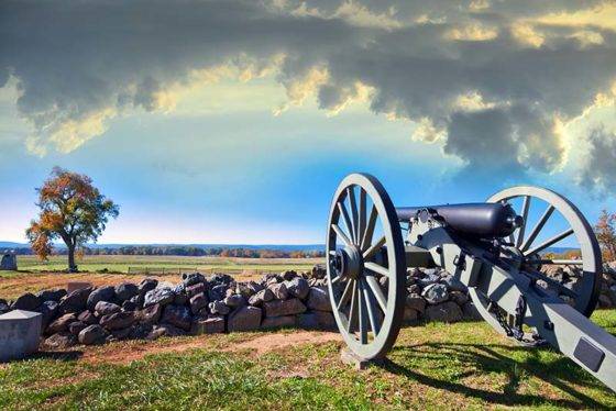 Civil War cannon on the Gettysburg battlefield in autumn near sunset