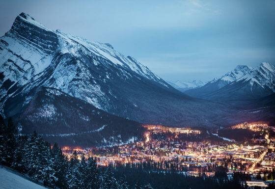 image of Banff, Alberta at night. Townsite and surrounding mountains.