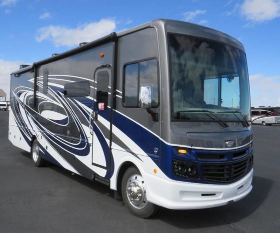 Image of a white 2023 Fleetwood Bounder Class A Gas Motorhome with dark blue and slate graphics on side.